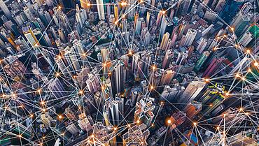 Digital network connection lines of Hong Kong Downtown. Financial district and business centers in smart city in technology concept. Top view of skyscraper and high-rise buildings. Aerial view