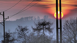 Strommast und Sonnenuntergang