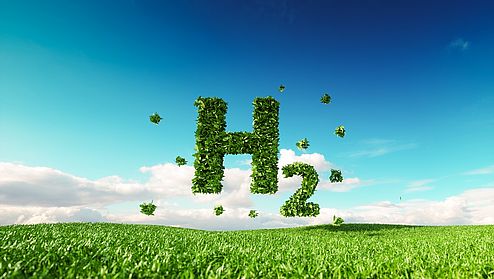Eco friendly clean hydrogen energy concept. 3d rendering of hydrogen icon on fresh spring meadow with blue sky in background.